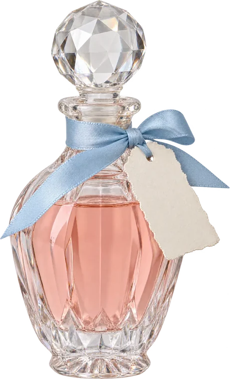 Frasquito de cristal con etiqueta «Bébeme»